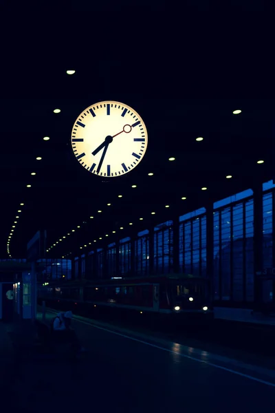 Clock over the platform of the train station in Berlin — Stock Photo, Image