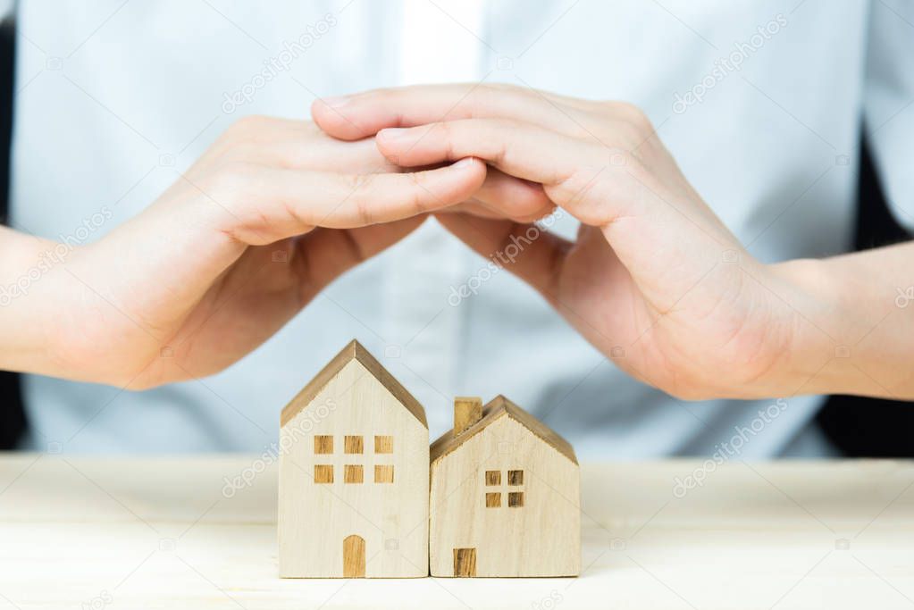 Hand cover wooden house to protect