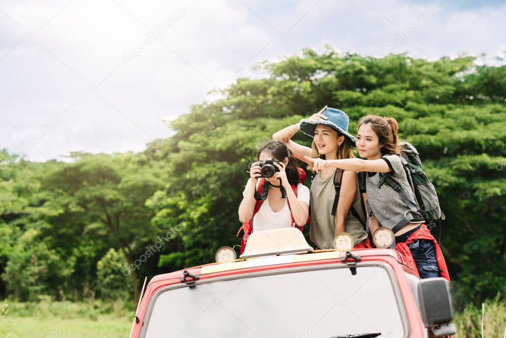 Asian women friends backpacker enjoy nuture during vacation 