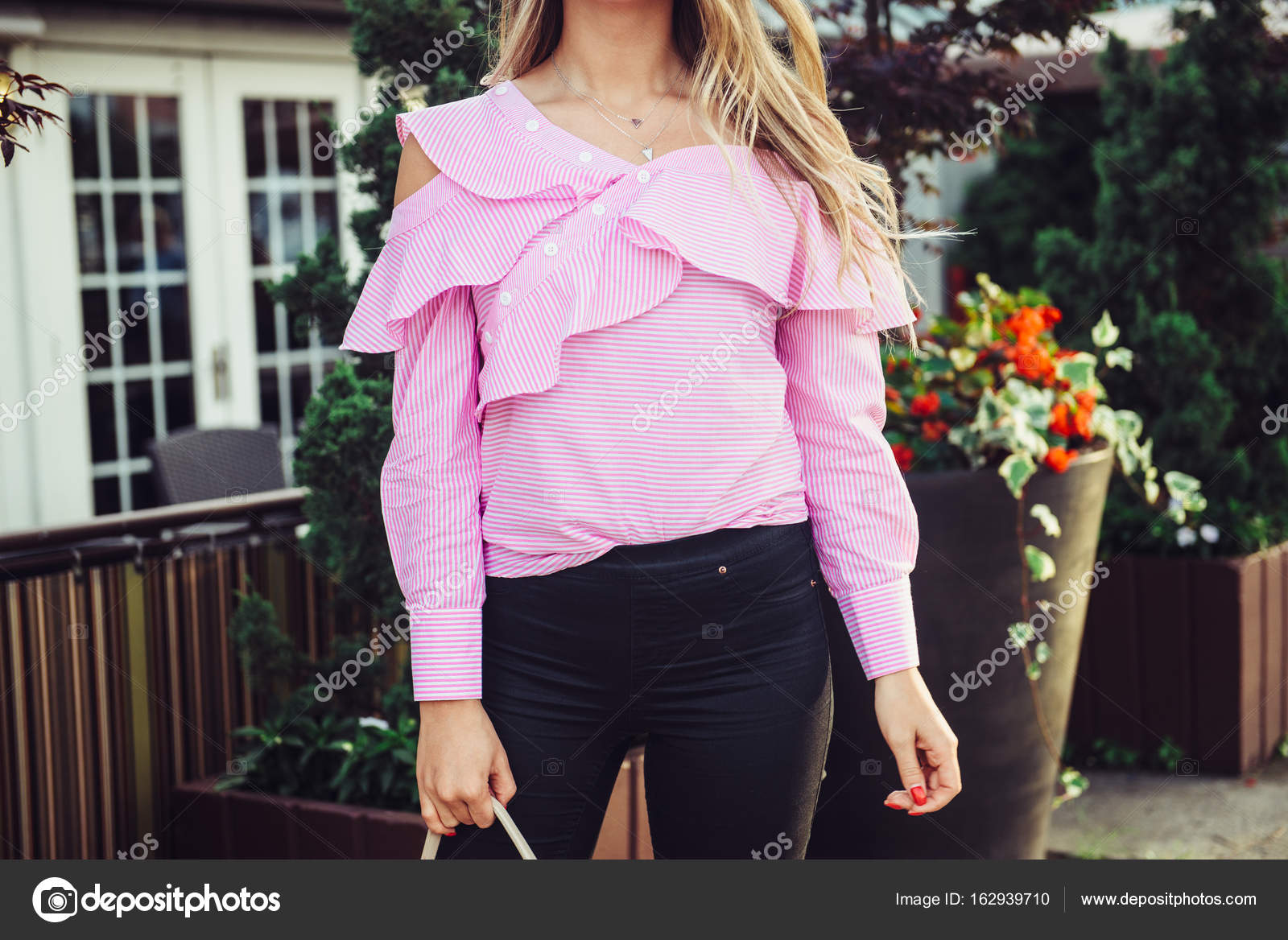 Casual style summer female outfit with pink t-shirt and black pants Stock  Photo by ©JANIFEST 162939710