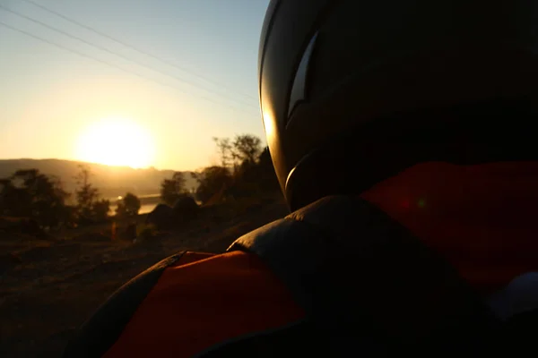 Biker driving a motorcycle rides along the asphalt road. — Stock Photo, Image