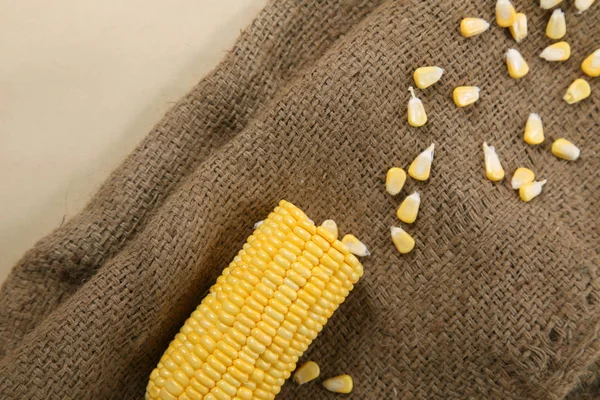 Fresh corn on cobs on texture background, closeup, top view — Stock Photo, Image