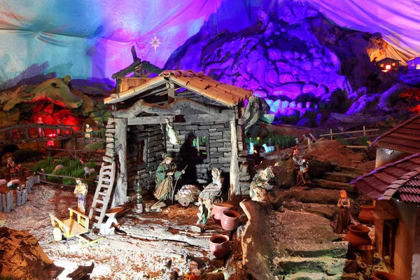 Christmas nativity scene with figurines including Jesus, Mary, Joseph, and sheeps