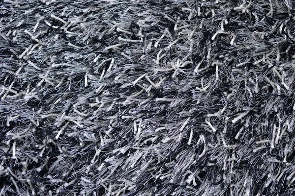 Closeup on textured fluffy textile synthetic fur for the background — Stock Photo, Image