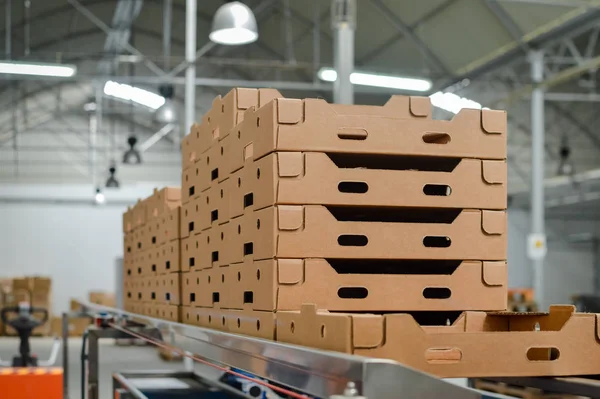 Stack of folded paper box in warehouse — Stock Photo, Image