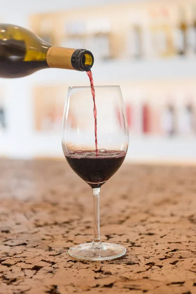 Red Wine pouring in a glass and Bottle — Stock Photo, Image