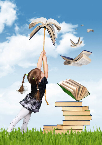 Education creative concept, child girl fly on book
