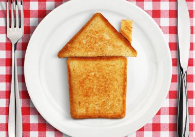 Tablo ayarı plaka üzerinde bir ev kavramı