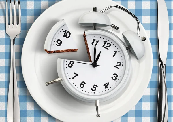 Time to meal concept, cut clock on plate. top view