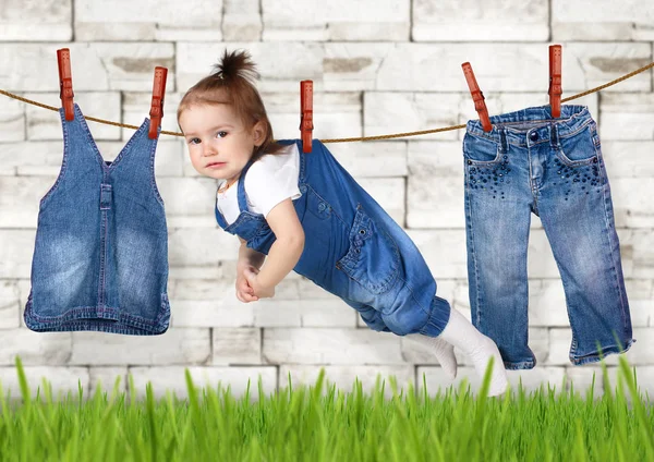 Failed housework creative concept, Funny child hanging on clothe — Stock Photo, Image