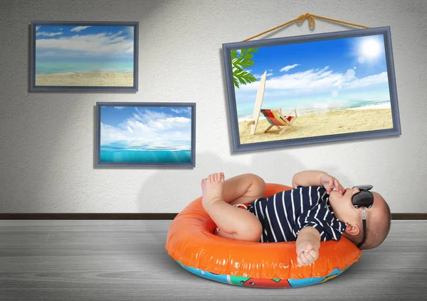 Funny baby on swimming circle at home, as on the beach. Vacation — Stock Photo, Image