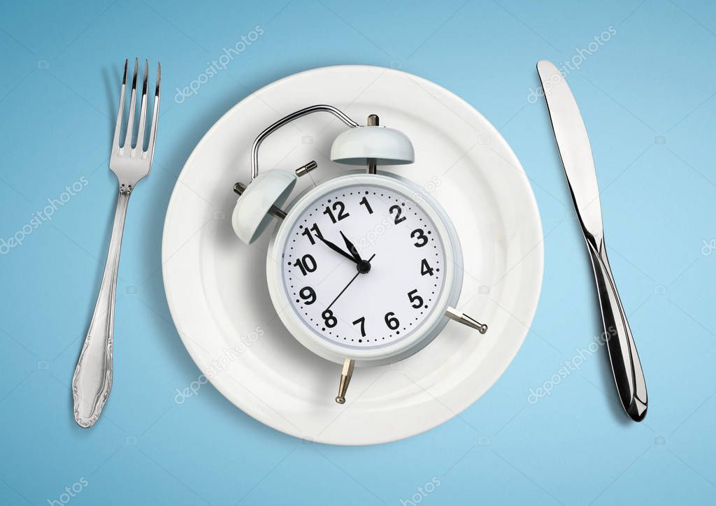 Concept of intermittent fasting, lunchtime, diet and weight loss