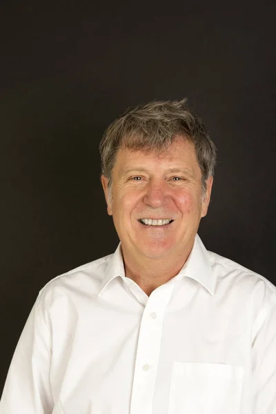 Mature man in white business shirt laughing — Stock Photo, Image