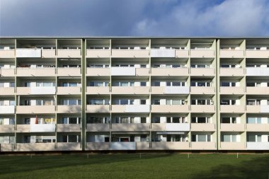 facade with balconys of a social housing complex in Munich clipart