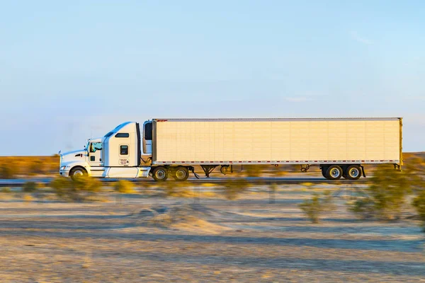 Truck on highway 8 in sunrise — Stock Photo, Image