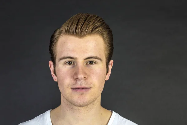 Cool looking teenage boy in studio — Stock Photo, Image