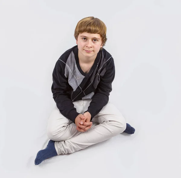 Happy young boy posing in studio — Stock Photo, Image