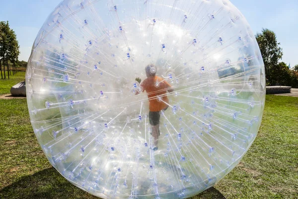 Children have fun in the Zorbing Ball — Stock Photo, Image