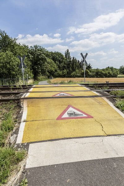 train warning sign at a railroad crossing
