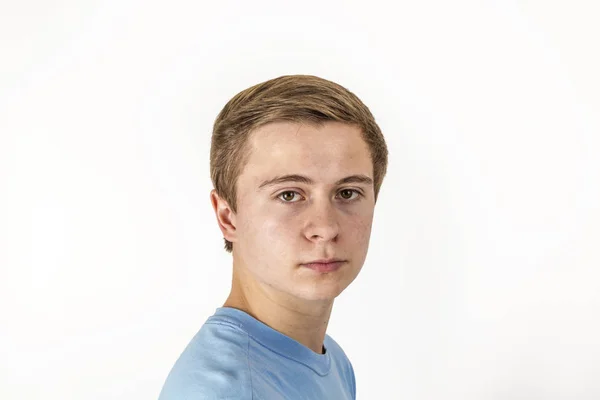 Cool boy with blue shirt posing in studio — Stock Photo, Image