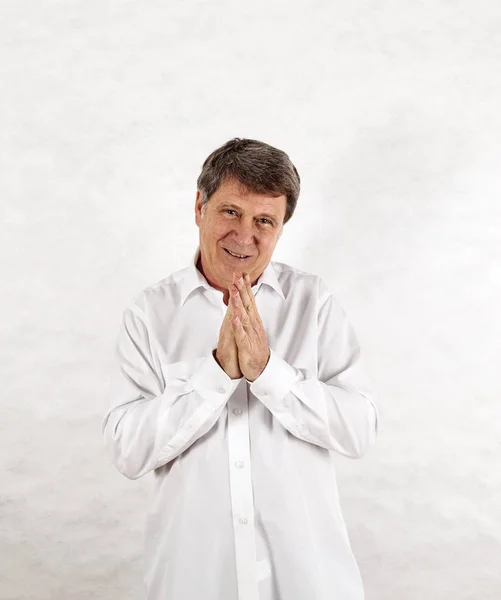 Happy senior man standing gesturing against white background — Stock Photo, Image