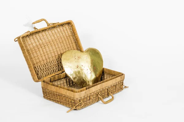 Golden heart in an open basket — Stock Photo, Image