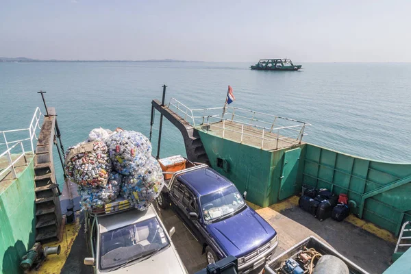 Ferry with loading platform and cars, cars are loaded with cans — Stock Photo, Image