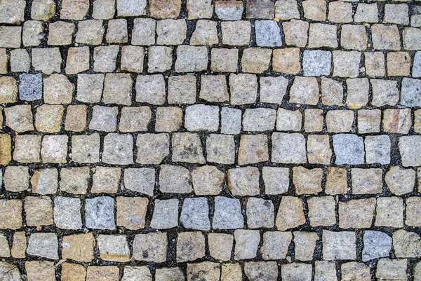 Patroon van oude stenen geplaveide straat — Stockfoto