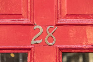 house number 28 at the  red entrance door clipart
