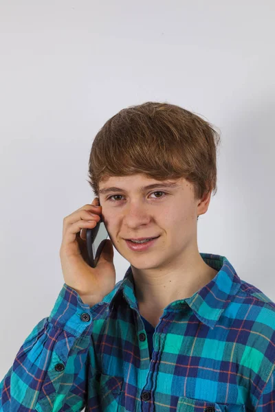 Boy talking at modern mobile phone — Stock Photo, Image