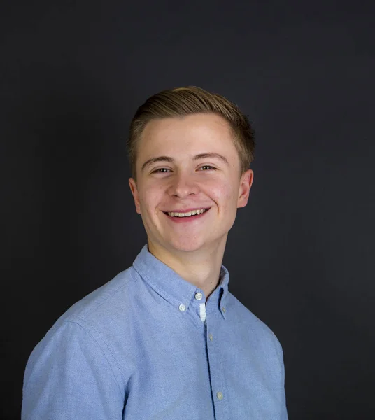 Cute teenage boy  isolated on black — Stock Photo, Image