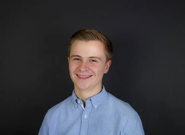 Cute teenage boy  isolated on black — Stock Photo, Image