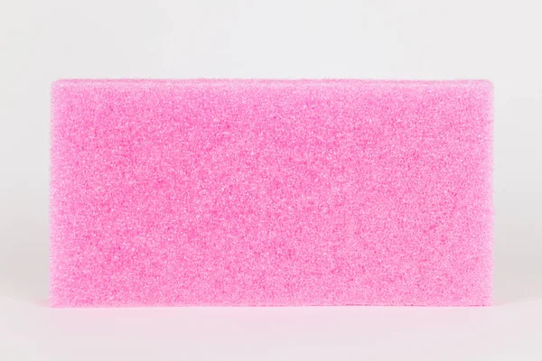 Material de embalagem de plástico rosa isolado no branco — Fotografia de Stock