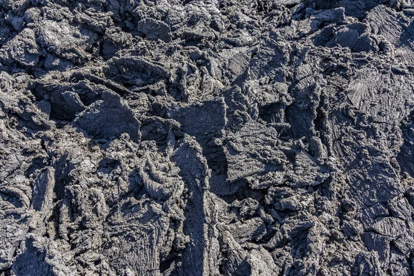 Fundo do fluxo de lava fria no parque nacional de Timanfaya — Fotografia de Stock
