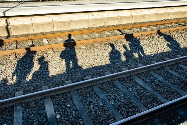 Shadow of people waiting for the train — Stock Photo, Image