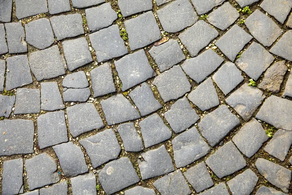 Muster aus Kopfsteinpflaster an einer alten Straße — Stockfoto