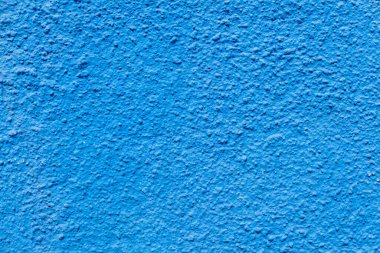 Mavi alçı duvara harmonik Akdeniz arkaplanı olarak bak