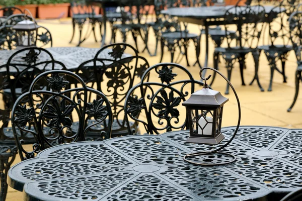 Chairs and tables with old lantern — Stock Photo, Image