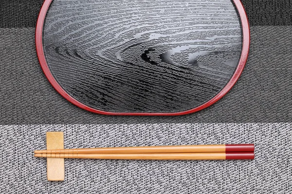 Chopsticks and empty tray — Stock Photo, Image