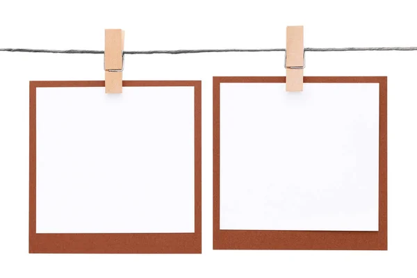 Photo frame hung on rope with clothespin — Stock Photo, Image