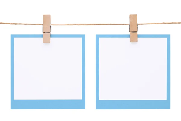 Photo frame hung on rope with clothespin — Stock Photo, Image