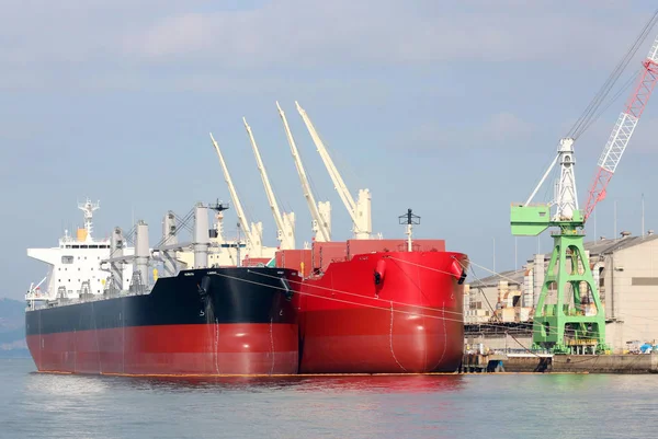 Cargo ship docked in port — Stock Photo, Image