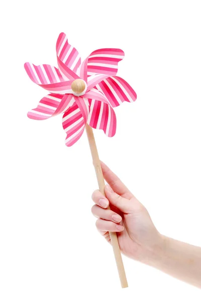 Hand met speelgoed pinwheel — Stockfoto