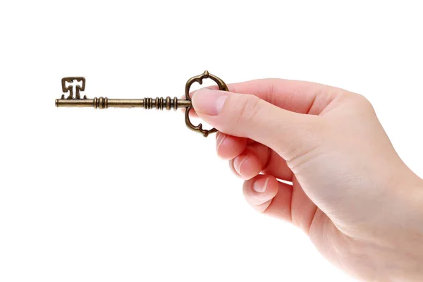 Hand holding antique key — Stock Photo, Image