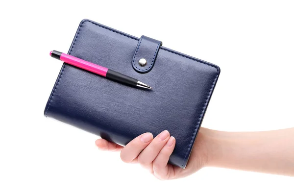 Hand holding blue leather notebook — Stock Photo, Image