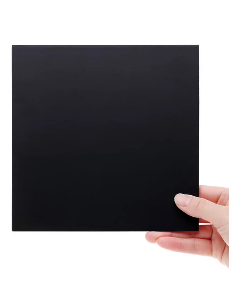 Ręka trzyma czarny deska — Zdjęcie stockowe