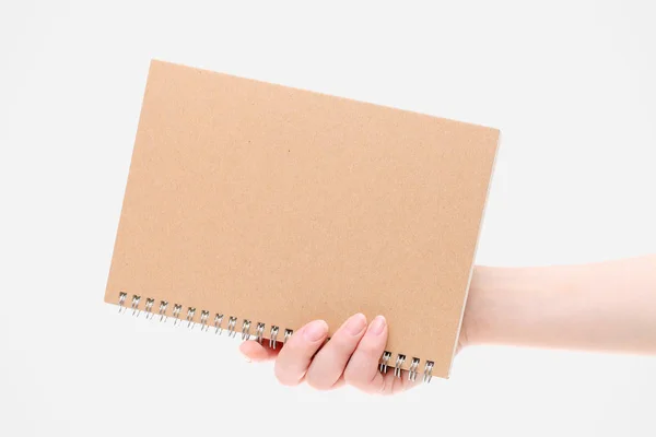 Hand innehav tom spiral notebook — Stockfoto