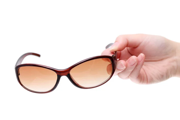 Hand mit brauner Sonnenbrille — Stockfoto