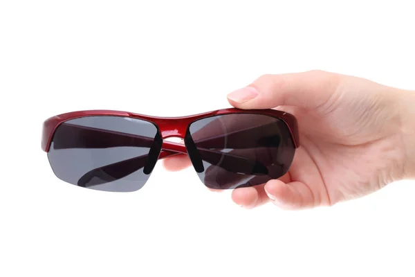 Ręka gospodarstwa czarne okulary przeciwsłoneczne — Zdjęcie stockowe