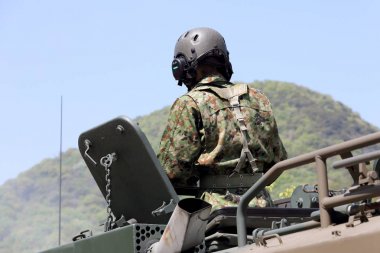 Japanese soldier in the armored vehicle clipart